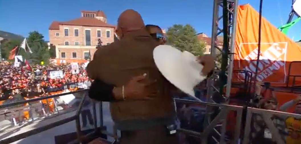 Deion Sanders embraces The Rock