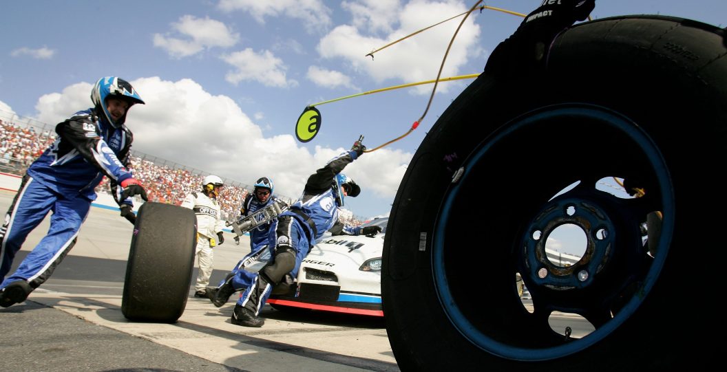 NASCAR pitstops require choreographed chaos to change tires and fill the gas tank quickly and precisely.