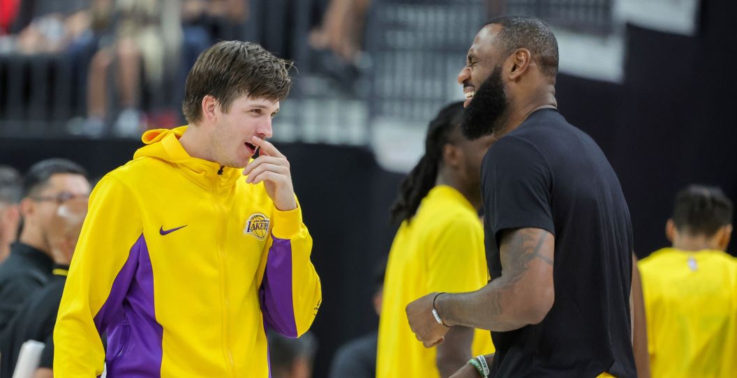 Austin Reaves and LeBron James share a laugh.