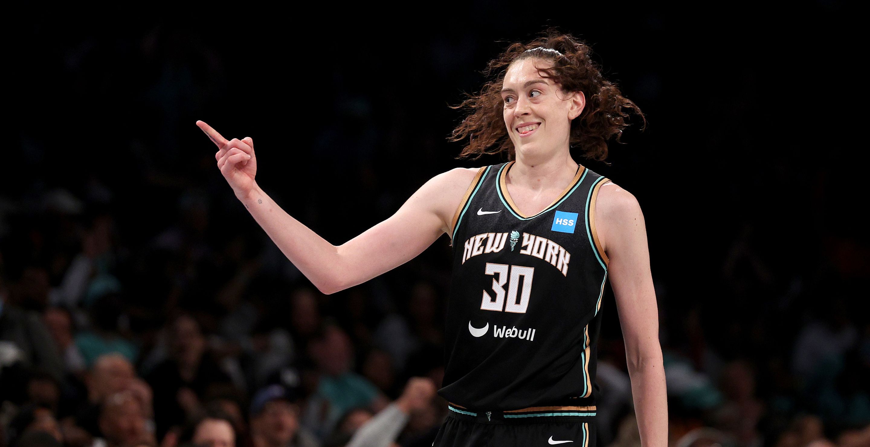 Breanna Stewart points her finger with the Liberty.