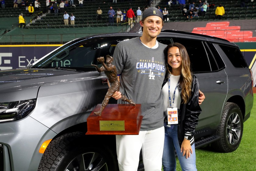 Corey Seager and his wife pose with a trophy.