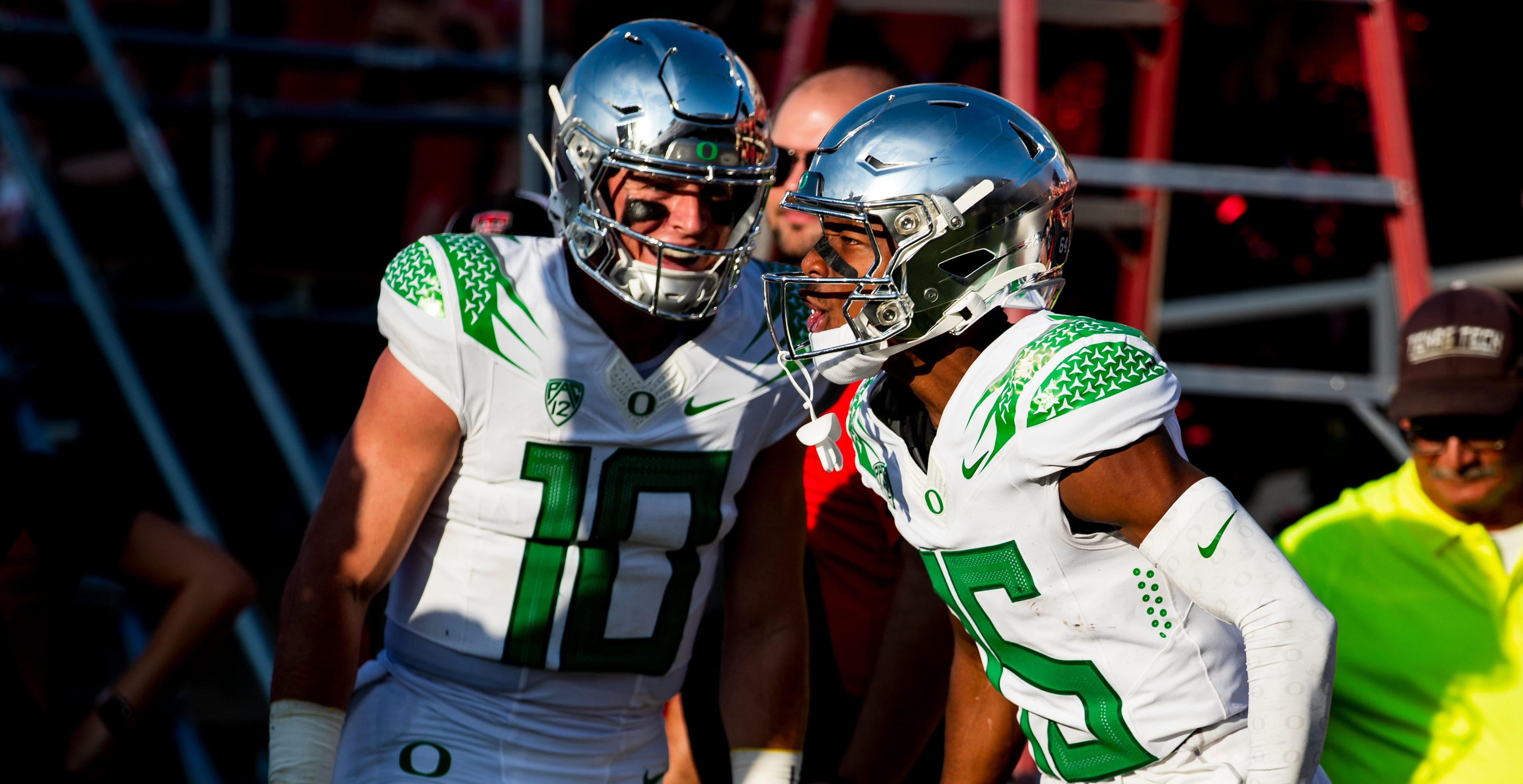 LUBBOCK, TEXAS - SEPTEMBER 09: Tez Johnson #15 of the Oregon Ducks celebrates with Bo Nix #10 after scoring a touchdown during the first half of the game against the Texas Tech Red Raiders at Jones AT&T Stadium on September 09, 2023 in Lubbock, Texas.