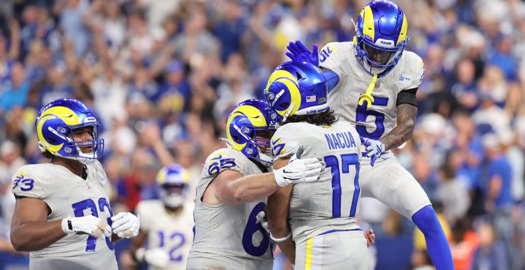 Puka Nacua #17 of the Los Angeles Rams is congratulated by teammates after scoring the game-winning touchdown against Julian Blackmon #32 of the Indianapolis Colts during the fourth quarter at Lucas Oil Stadium on October 01, 2023 in Indianapolis, Indiana.