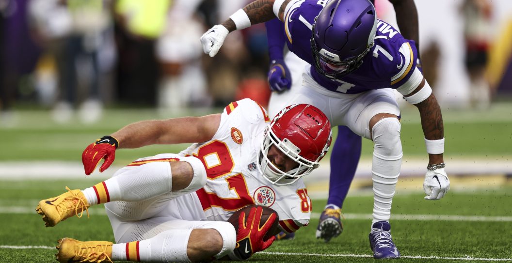 Travis Kelce #87 of the Kansas City Chiefs winces in pain after sustaining an injury on a play during the second quarter of an NFL football game against the Minnesota Vikings at U.S. Bank Stadium on October 8, 2023 in Minneapolis, Minnesota.