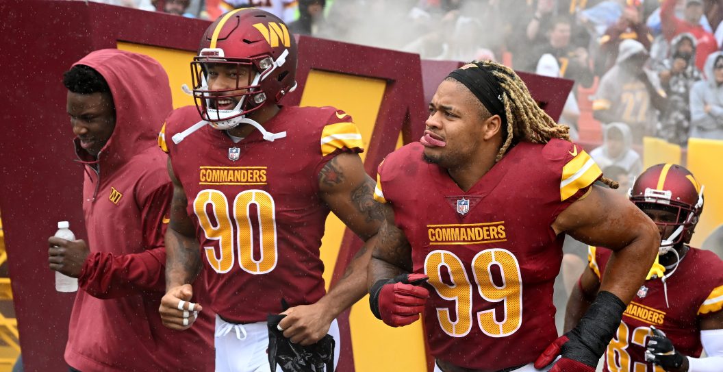 LANDOVER, MARYLAND - SEPTEMBER 24: Montez Sweat #90 and Chase Young #99 of the Washington Commanders run onto the field before the game against the Buffalo Bills at FedExField on September 24, 2023 in Landover, Maryland.