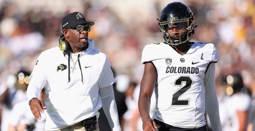 TEMPE, ARIZONA - OCTOBER 07: Head coach Deion Sanders of the Colorado Buffaloes talks with quarterback Shedeur Sanders #2 during first half of the NCAAF game against the Arizona State Sun Devils at Mountain America Stadium on October 07, 2023 in Tempe, Arizona.