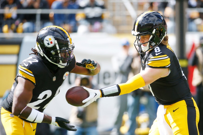 PITTSBURGH, PENNSYLVANIA - OCTOBER 08: Kenny Pickett #8 of the Pittsburgh Steelers hands the ball off to Najee Harris #22 of the Pittsburgh Steelers during the first quarter against the Baltimore Ravens at Acrisure Stadium on October 08, 2023 in Pittsburgh, Pennsylvania. 