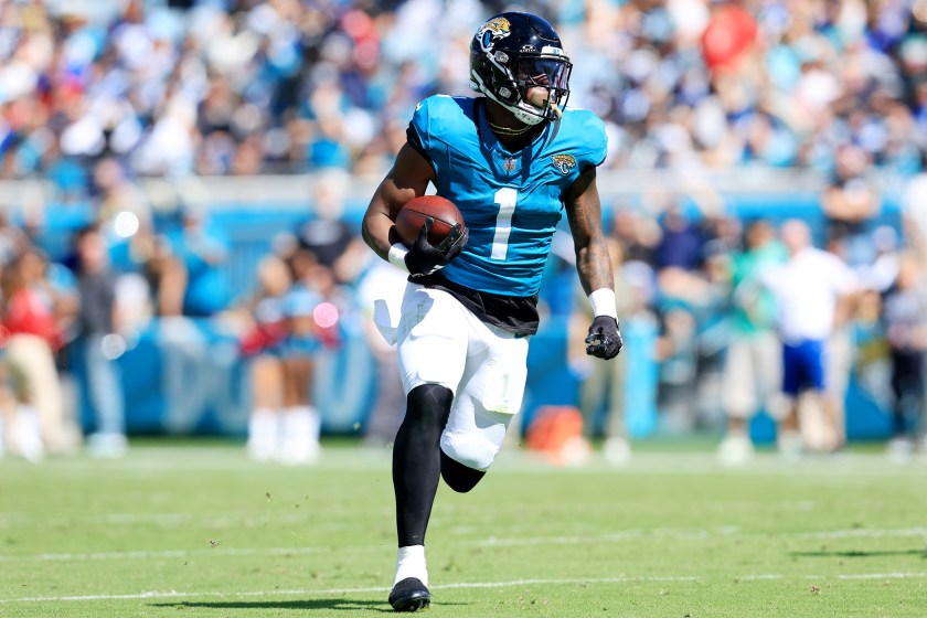JACKSONVILLE, FLORIDA - OCTOBER 15: Travis Etienne Jr. #1 of the Jacksonville Jaguars runs with the ball during the second quarter against the Indianapolis Colts at EverBank Stadium on October 15, 2023 in Jacksonville, Florida. 