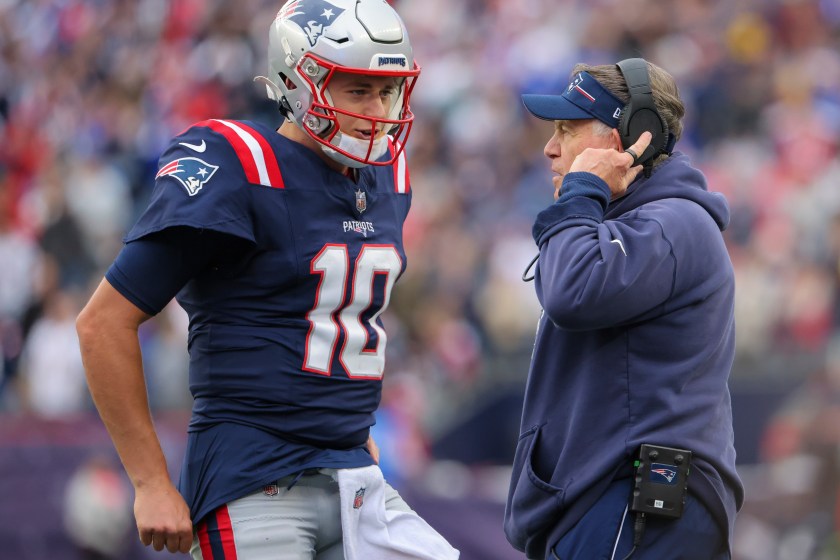 Foxborough, MA - October 22: New England Patriots QB Mac Jones talks with head coach Bill Belichick during at time out in the fourth quarter. The Patriots beat the Buffalo Bills, 29-25. 
