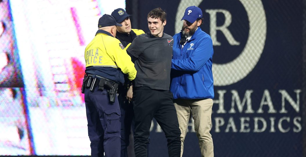 PHILADELPHIA, PENNSYLVANIA - OCTOBER 17: A fan is stopped by security after trying to run on the field after the Philadelphia Phillies defeated the Arizona Diamondbacks 10-0 in Game Two of the Championship Series at Citizens Bank Park on October 17, 2023 in Philadelphia, Pennsylvania.