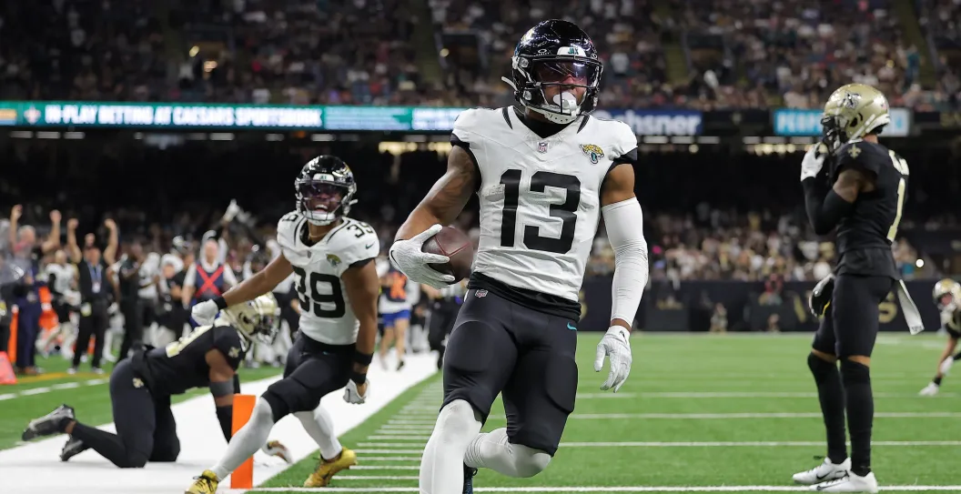 NEW ORLEANS, LOUISIANA - OCTOBER 19: Christian Kirk #13 of the Jacksonville Jaguars scores a 44-yard receiving touchdown during the fourth quarter against the New Orleans Saints at Caesars Superdome on October 19, 2023 in New Orleans, Louisiana.