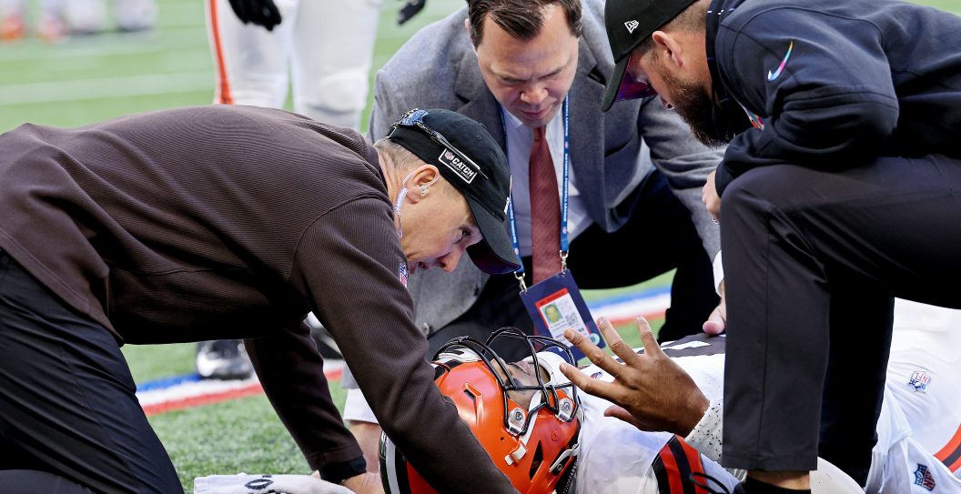 Deshaun Watson #4 of the Cleveland Browns is attended to by medical staff after an apparent injury