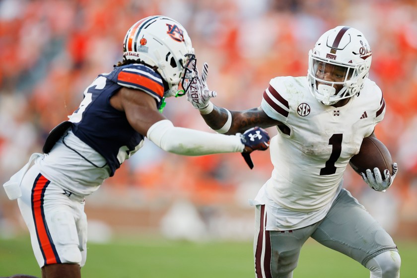 AUBURN, ALABAMA - OCTOBER 28: Zavion Thomas #1 of the Mississippi State Bulldogs runs the ball before being pushed out of bounds by Jaylin Simpson #36 of the Auburn Tigers during the fourth quarter at Jordan-Hare Stadium on October 28, 2023 in Auburn, Alabama. 