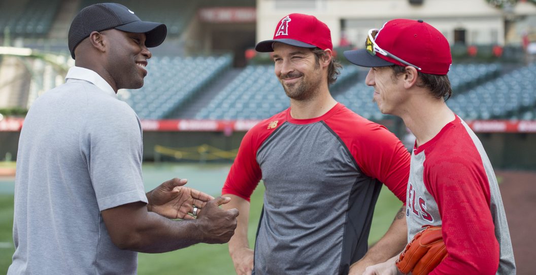 ANAHEIM, CA - JUNE 25: Former professional baseball player Torii Hunter talks with C.J. Wilson #33 and Tim Lincecum #55 of the Los Angeles Angels of Anaheim before the game against the Oakland Athletics at Angel Stadium of Anaheim on June 25, 2016 in Anaheim, California.