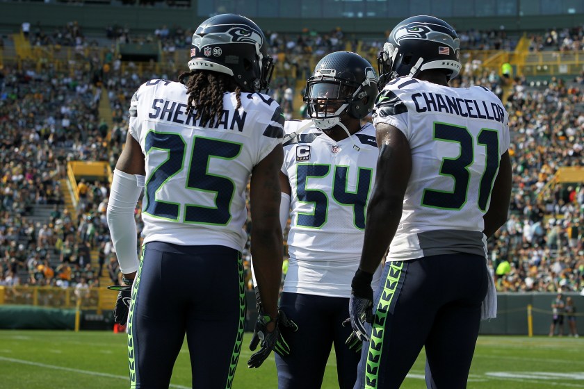 GREEN BAY, WI - SEPTEMBER 10:  Richard Sherman #25, Bobby Wagner #54 and Kam Chancellor #31 of the Seattle Seahawks meet before the game against the Green Bay Packers at Lambeau Field on September 10, 2017 in Green Bay, Wisconsin.  