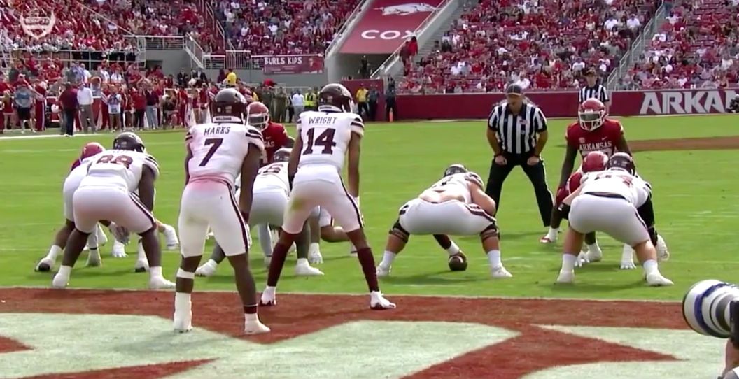 A Mississippi State center performs a bad snap.