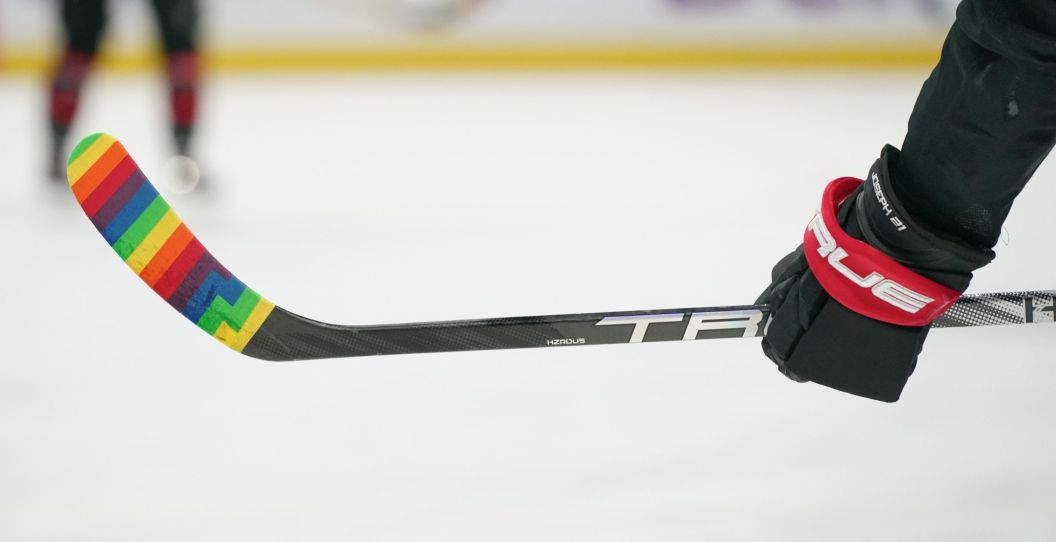 A view of Pride Tape on a hockey stick of an NHL player.