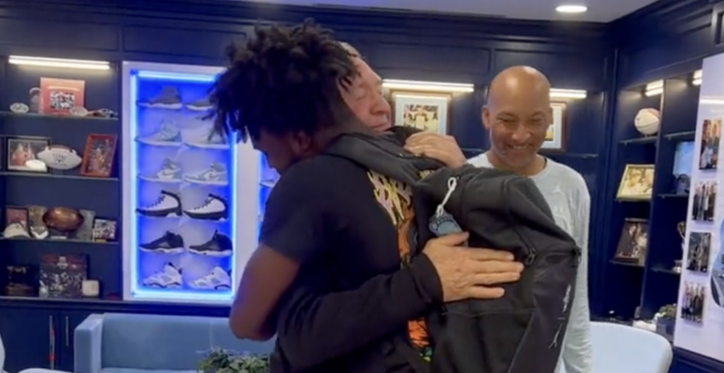 Tez Walker hugs his coach