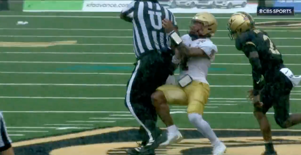 Boston College QB trucked by referee