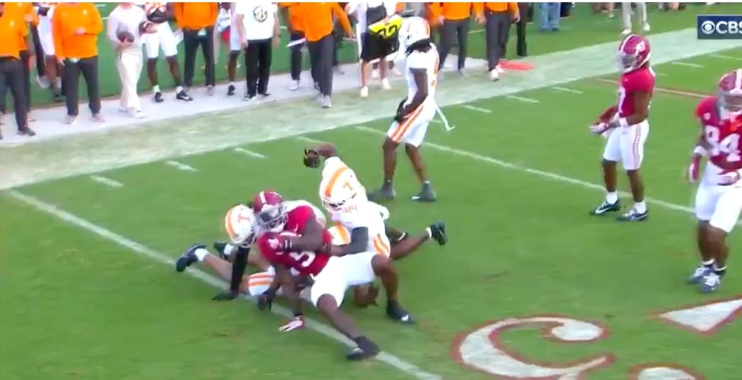 A Tennessee player punches an Alabama player.