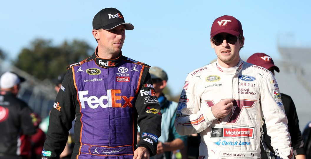 MARTINSVILLE, VA - OCTOBER 28: Denny Hamlin, driver of the #11 FedEx Freight Toyota, talks with Ryan Blaney, driver of the #21 Virginia Tech Ford, on the grid prior to qualifying for the NASCAR Sprint Cup Series Goody's Fast Relief 500 at Martinsville Speedway on October 28, 2016 in Martinsville, Virginia.