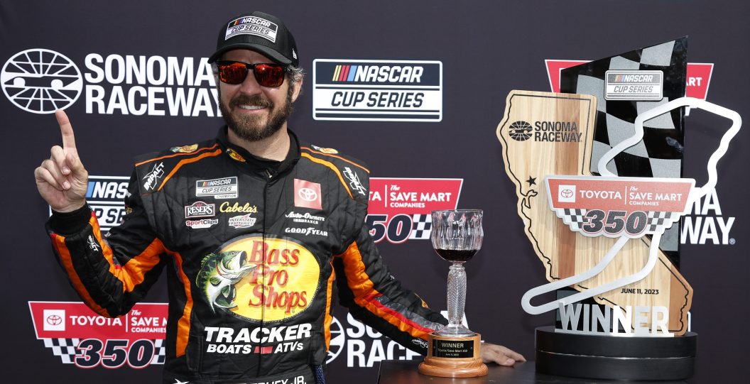 SONOMA, CALIFORNIA - JUNE 11: Martin Truex Jr., driver of the #19 Bass Pro Shops Toyota, celebrates in victory lane after winning the NASCAR Cup Series Toyota / Save Mart 350 at Sonoma Raceway on June 11, 2023 in Sonoma, California.