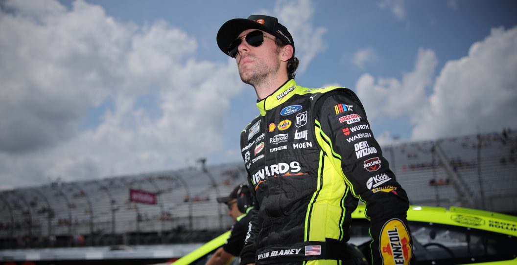 LOUDON, NEW HAMPSHIRE - JULY 15: Ryan Blaney, driver of the #12 Menards/Sylvania Ford, walks the grid during qualifying for the NASCAR Cup Series Crayon 301 at New Hampshire Motor Speedway on July 15, 2023 in Loudon, New Hampshire.