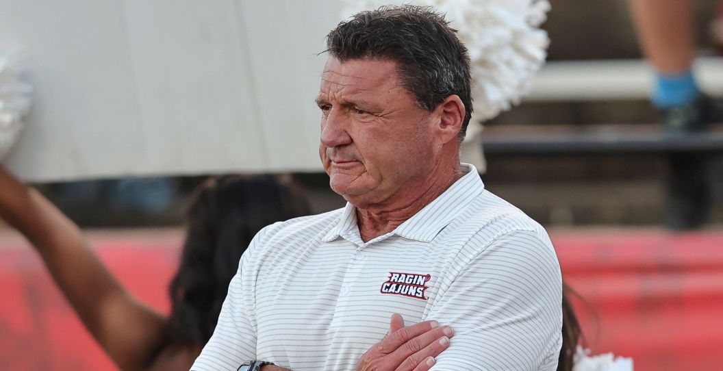 Ed Orgeron watches a college football game.