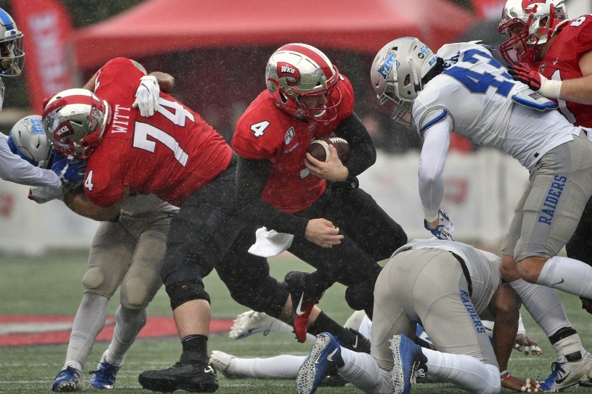 A Western Kentucky player is tackled.