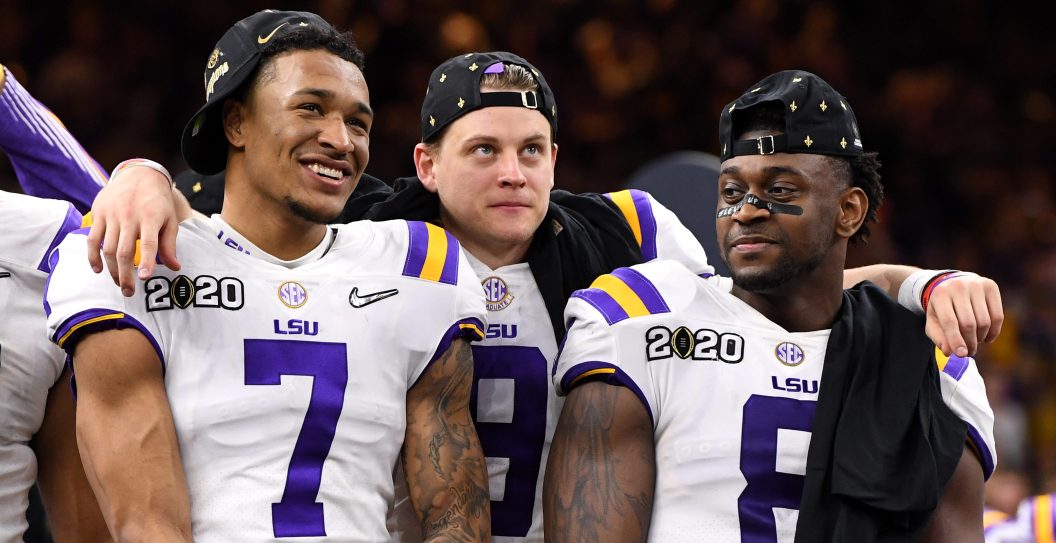 NEW ORLEANS, LA - JANUARY 13: Grant Delpit #7, Joe Burrow #9 and Patrick Queen #8 of the LSU Tigers celebrate after defeating the Clemson Tigers during the College Football Playoff National Championship held at the Mercedes-Benz Superdome on January 13, 2020 in New Orleans, Louisiana.