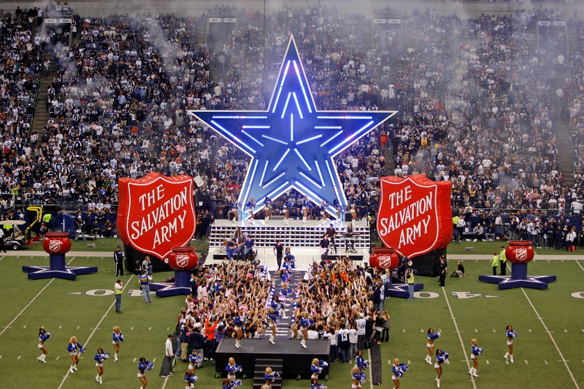 A halftime show sponsored by the Salvation Army plays at a Cowboys game.