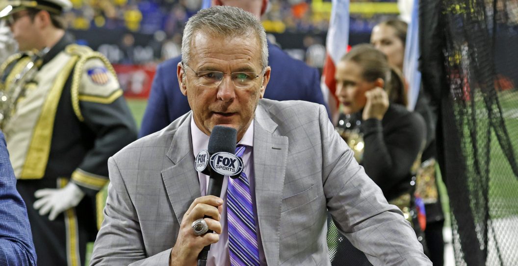 INDIANAPOLIS, IN - DECEMBER 03: Fox Sports announcer Urban Meyer talks on air during half time of the Purdue Boilermakers playing against the Michigan Wolverines on December 3, 2022, during the Big 10 Football Championship at Lucas Oil Stadium in Indianapolis, Indiana.