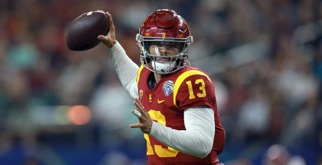 ARLINGTON, TEXAS - JANUARY 02: Caleb Williams #13 of the USC Trojans throws a touchdown pass against the Tulane Green Wave in the second quarter of the Goodyear Cotton Bowl Classic on January 02, 2023 at AT&T Stadium in Arlington, Texas.