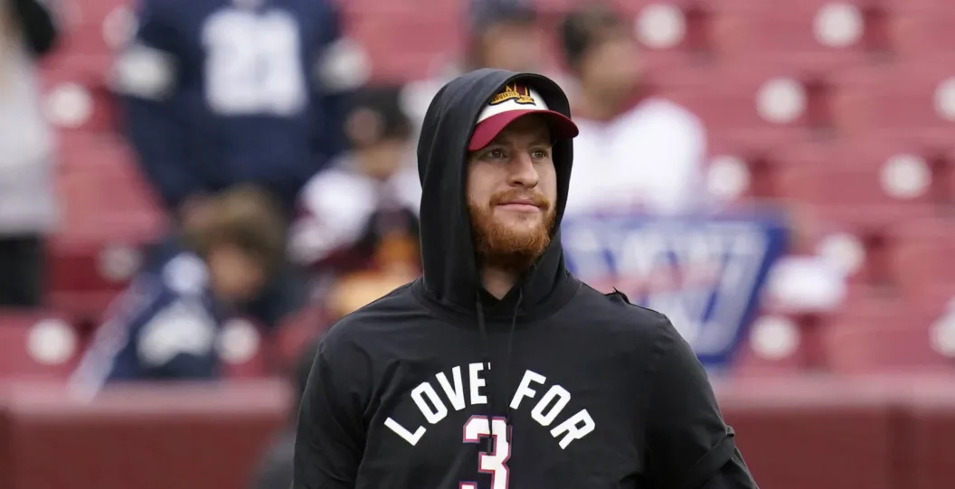 LANDOVER, MARYLAND - JANUARY 08: Carson Wentz #11 of the Washington Commanders wears a shirt in support of Buffalo Bills safety Damar Hamlin prior to the game against the Dallas Cowboys at FedExField on January 08, 2023 in Landover, Maryland.