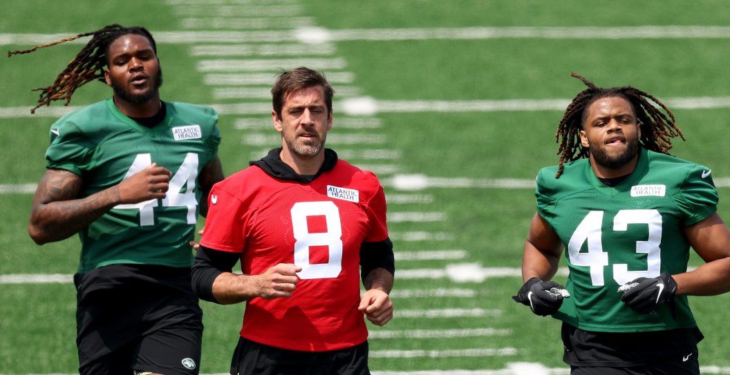 FLORHAM PARK, NEW JERSEY - MAY 23: Jamien Sherwood #44 Aaron Rodgers #8,Caleb Johnson #43 and Zach Wilson #2 of the New York Jets run during an offseason workout session at Atlantic Health Jets Training Center on May 23, 2023 in Florham Park, New Jersey.