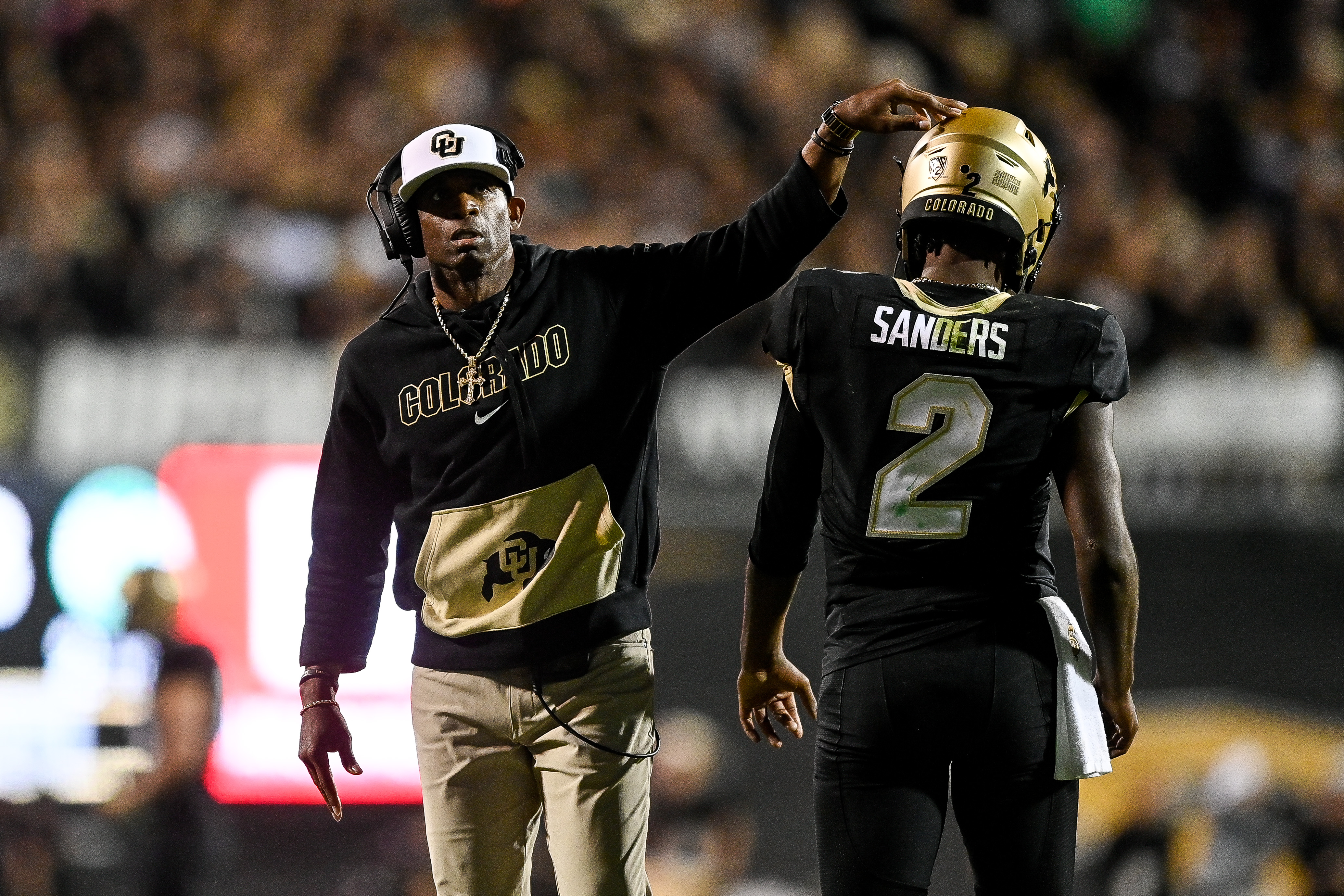 BOULDER, CO - SEPTEMBER 16: Head coach Deion Sanders of the Colorado Buffaloes celebrates with quarterback Shedeur Sanders #2 after a fourth quarter touchdown against the Colorado State Rams at Folsom Field on September 16, 2023 in Boulder, Colorado. 
