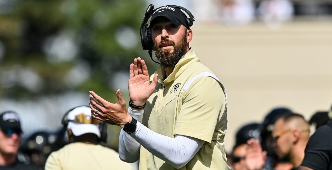 BOULDER, CO - SEPTEMBER 30: Offensive coordinator Sean Lewis of the Colorado Buffaloes claps after an offensive touchdown in the fourth quarter against the USC Trojans at Folsom Field on September 30, 2023 in Boulder, Colorado.