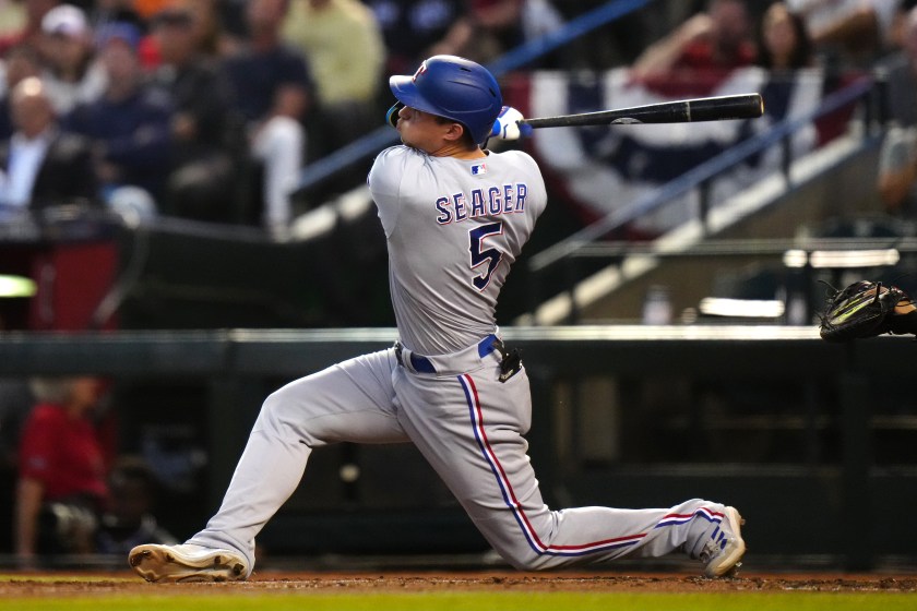 PHOENIX, AZ - OCTOBER 31: Corey Seager #5 of the Texas Rangers hits a two-ru home run in the second inning during Game 4 of the 2023 World Series between the Texas Rangers and the Arizona Diamondbacks at Chase Field on Tuesday, October 31, 2023 in Phoenix, Arizona. 