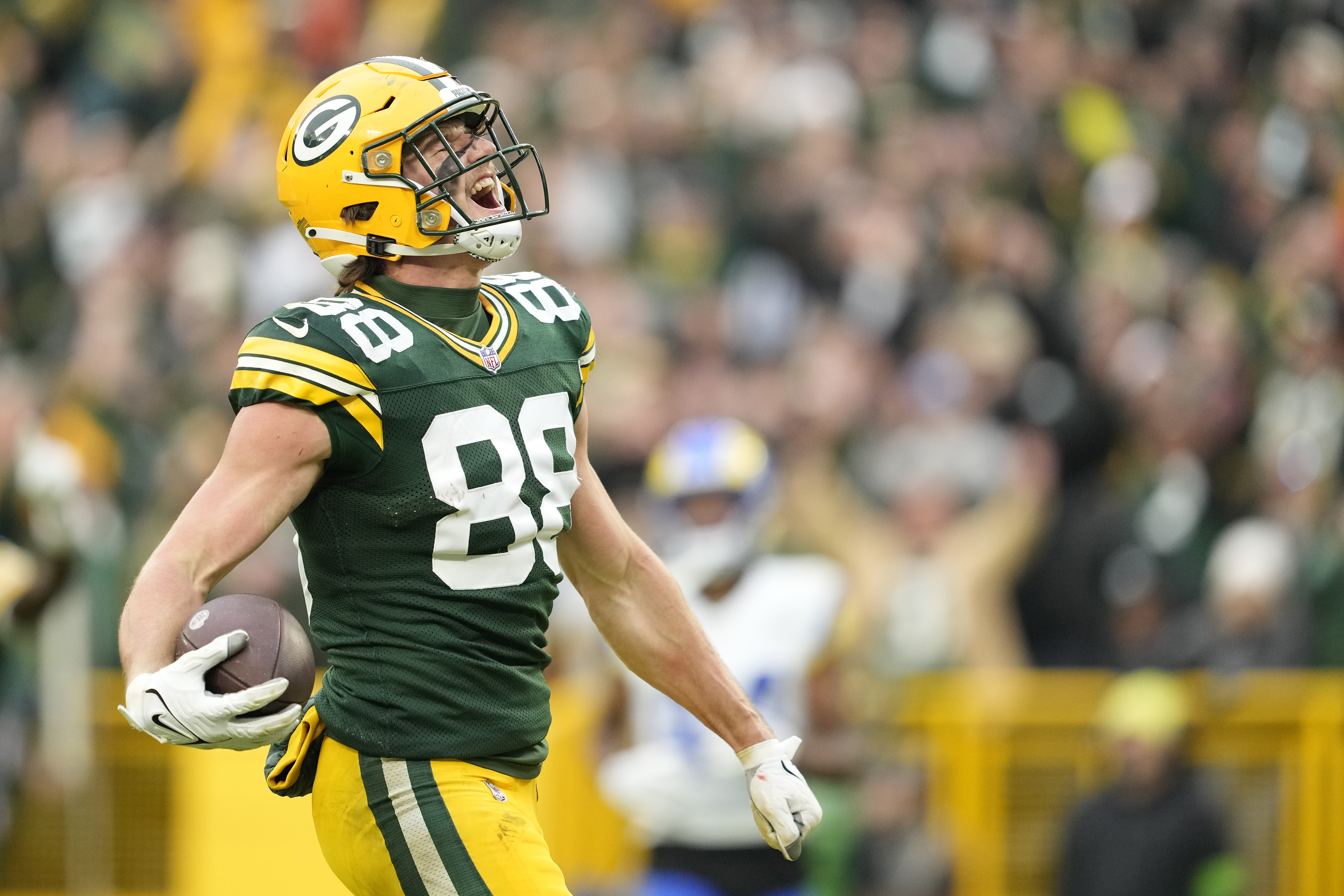 GREEN BAY, WISCONSIN - NOVEMBER 05: Luke Musgrave #88 of the Green Bay Packers reacts after scoring a touchdown in the fourth quarter of a game against the Los Angeles Rams at Lambeau Field on November 05, 2023 in Green Bay, Wisconsin. 