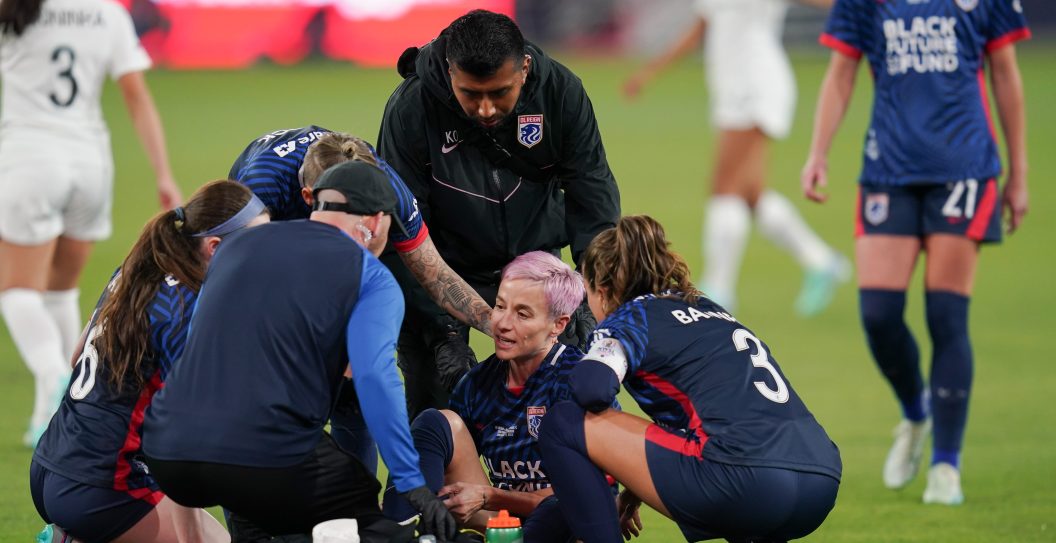 SAN DIEGO, CALIFORNIA - NOVEMBER 11: Megan Rapinoe #15 of OL Reign goes down with an injury early in the first half of the game against the NJ/NY Gotham FC during the 2023 NWSL Championship at Snapdragon Stadium on November 11, 2023 in San Diego, California.