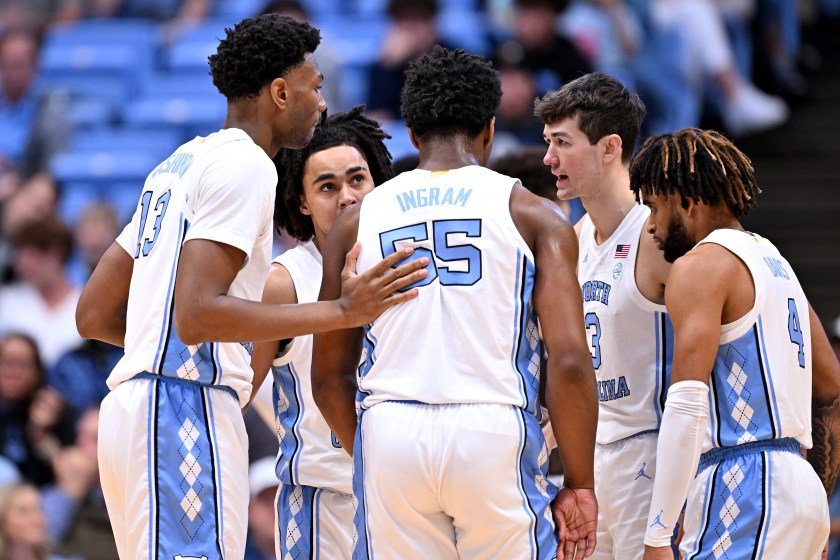 Members of North Carolina's basketball team huddle.
