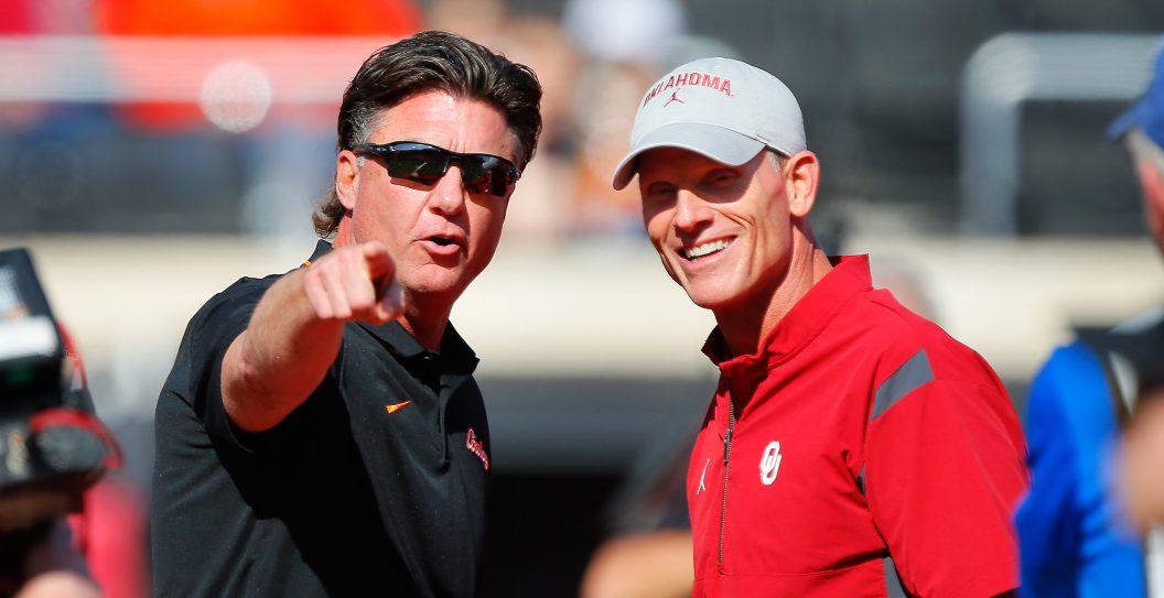 STILLWATER, OK - NOVEMBER 4: Head coach Mike Gundy of the Oklahoma State Cowboys talks with head coach Brent Venables of the Oklahoma Sooners before a Bedlam game at Boone Pickens Stadium on November 4, 2023 in Stillwater, Oklahoma. Oklahoma State won 27-24.