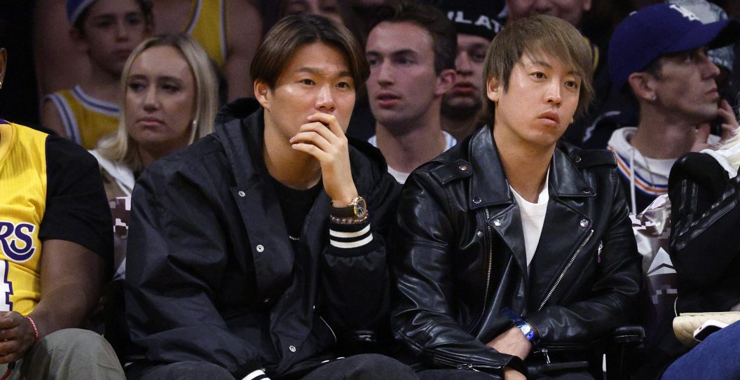 LOS ANGELES, CALIFORNIA - NOVEMBER 22: Japanese pitcher Yoshinobu Yamamoto (L) attends a basketball game between the Los Angeles Lakers and the Dallas Mavericks at Crypto.com Arena on November 22, 2023 in Los Angeles, California. NOTE TO USER: User expressly acknowledges and agrees that, by downloading and or using this photograph, User is consenting to the terms and conditions of the Getty Images License Agreement.