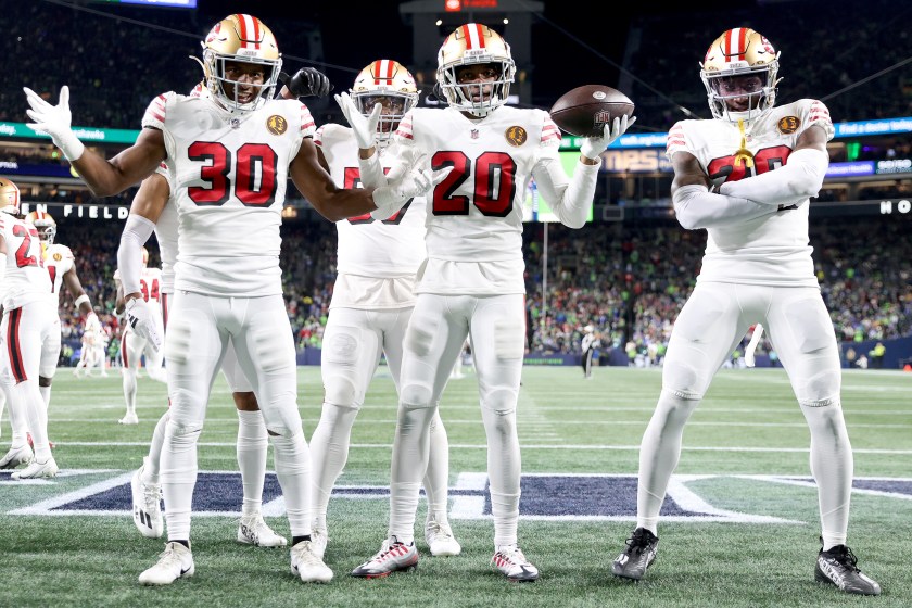 SEATTLE, WASHINGTON - NOVEMBER 23: Ambry Thomas #20 of the San Francisco 49ers celebrates an interception with teammates during the second quarter of a game against the Seattle Seahawks at Lumen Field on November 23, 2023 in Seattle, Washington. 