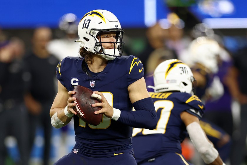 INGLEWOOD, CALIFORNIA - NOVEMBER 26: Justin Herbert #10 of the Los Angeles Chargers looks to pass the ball during the fourth quarter against the Baltimore Ravens at SoFi Stadium on November 26, 2023 in Inglewood, California. 