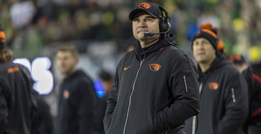 EUGENE, OREGON - NOVEMBER 24: Head coach Jonathan Smith of the Oregon State Beavers stands on the field during the first half against the Oregon Ducksat Autzen Stadium on November 24, 2023 in Eugene, Oregon.