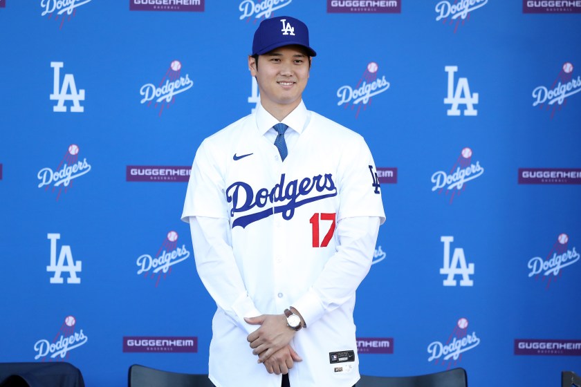 Shohei Ohtani stands in a Dodgers uniform.