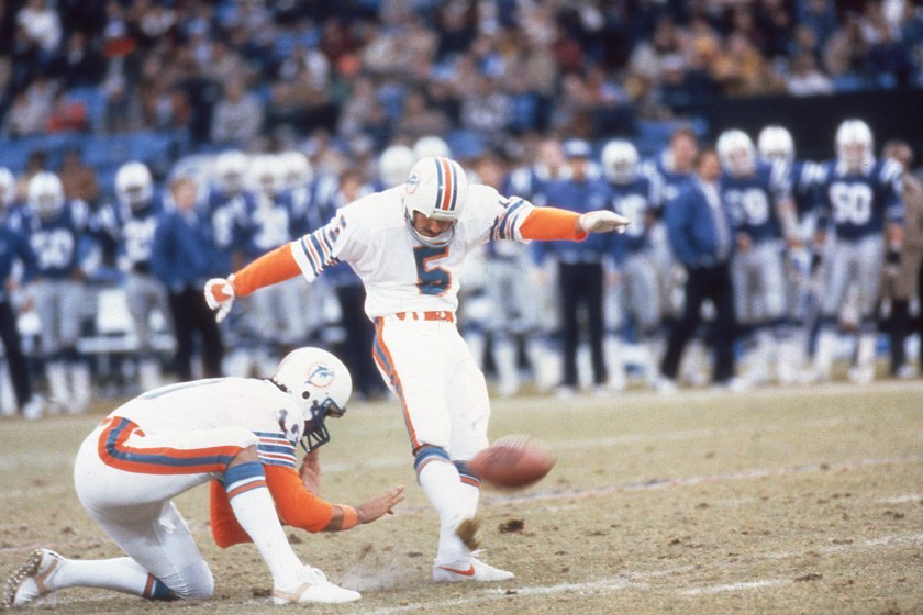 BALTIMORE, MD: Uwe von Schamann of the Miami Dolphins circa 1982 attempts a field goal against the Baltimore Colts at Memorial Stadium in Baltimore, Maryland.  