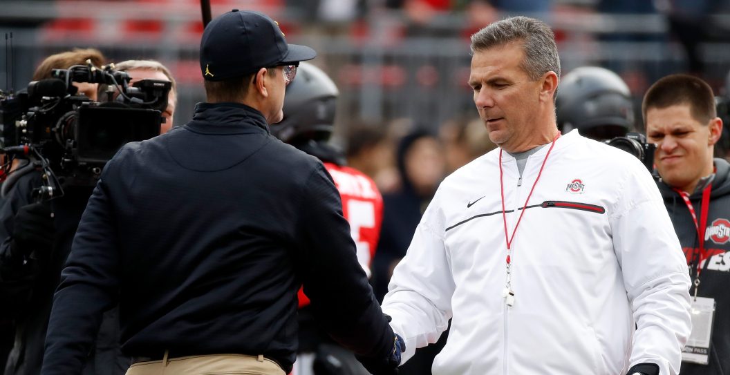 COLUMBUS, OH - NOVEMBER 26: (R-L) Head coach Urban Meyer of the Ohio State Buckeyes and Head coach Jim Harbaugh of the Michigan Wolverines shake hands on the field prior to their game at Ohio Stadium on November 26, 2016 in Columbus, Ohio.