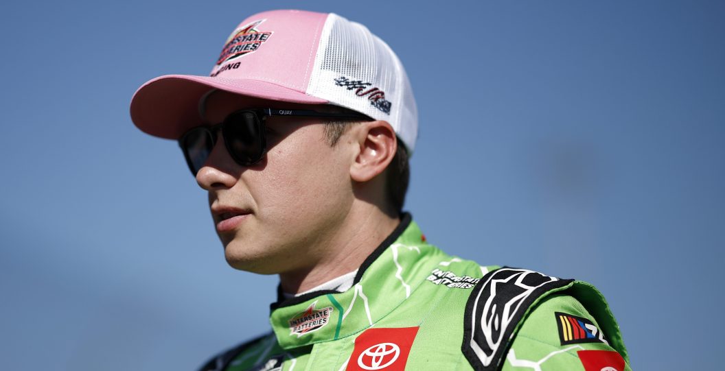 MARTINSVILLE, VIRGINIA - OCTOBER 29: Christopher Bell, driver of the #20 Interstate Batteries Toyota, walks the grid prior to the NASCAR Cup Series Xfinity 500 at Martinsville Speedway on October 29, 2023 in Martinsville, Virginia.